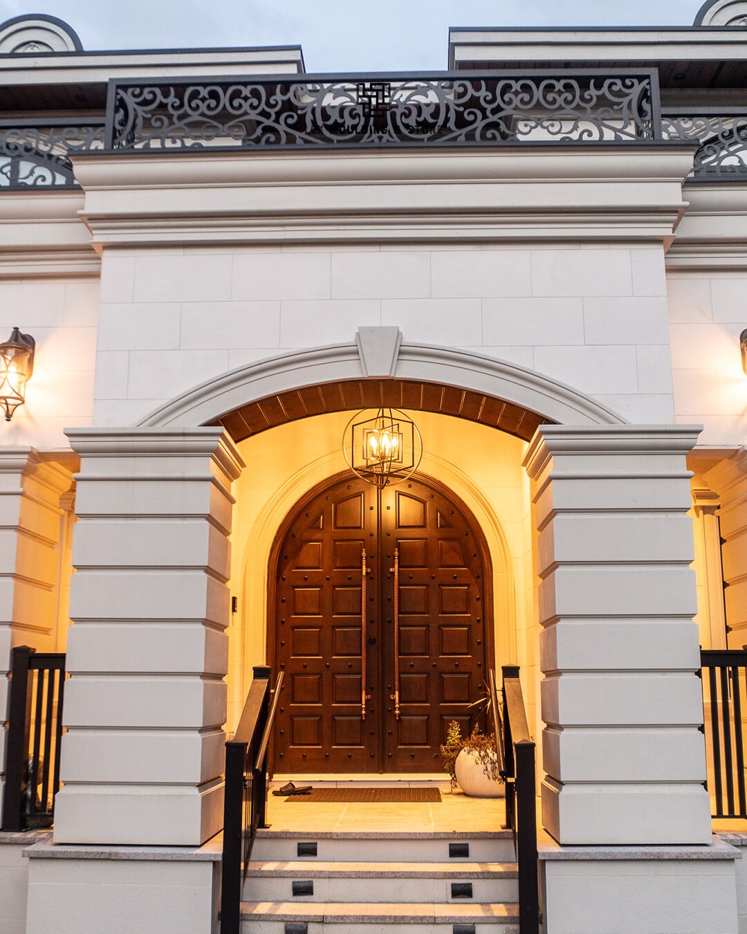 Grand front entry with moulding and stone